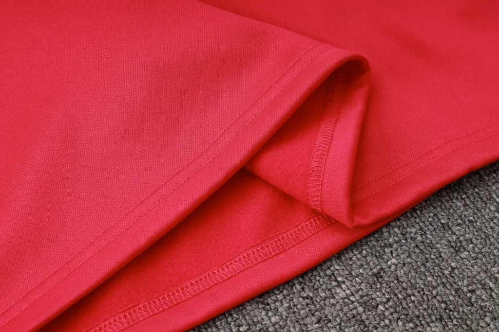 Red fabric texture and stitching