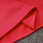 Red fabric texture and stitching