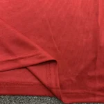 Red mesh fabric and hem close-up