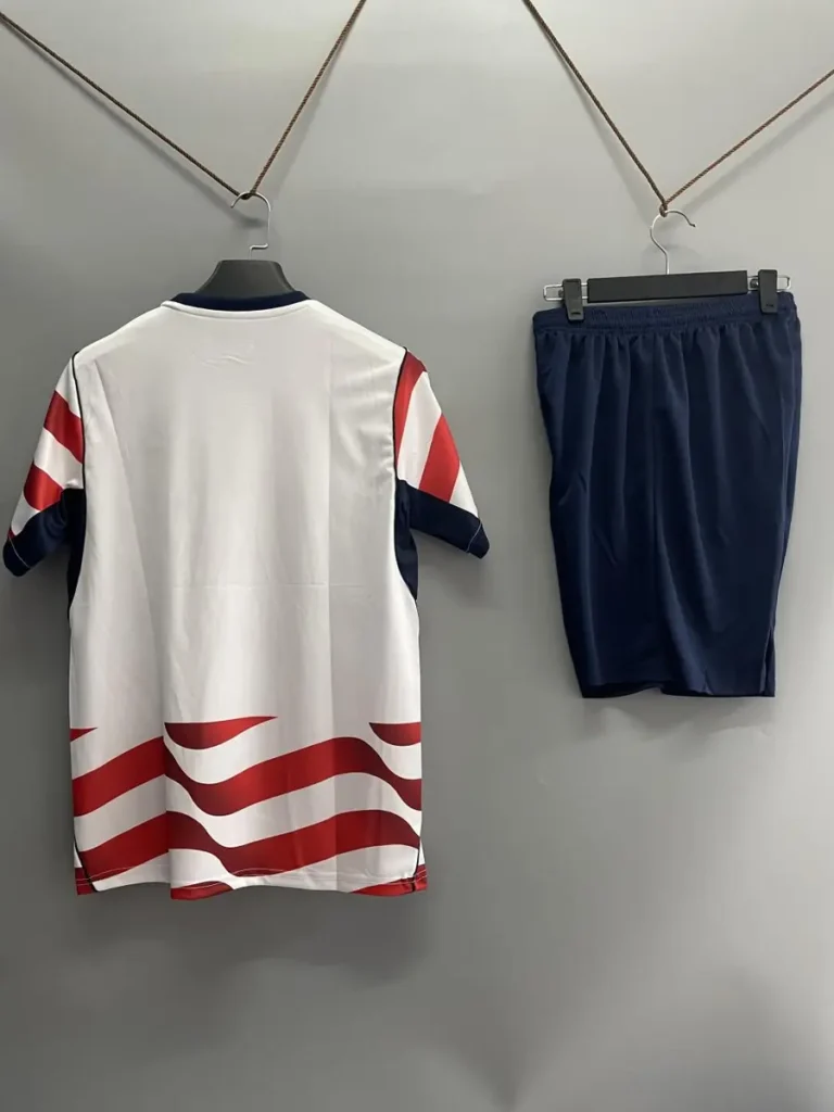 Red white wave stripe jersey and navy shorts back