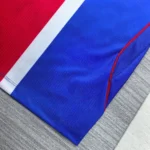 Blue football jersey side mesh detail