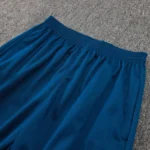Teal pants side detail