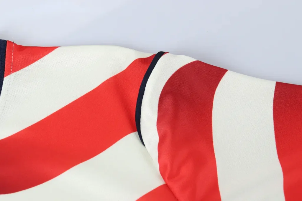 Navy sleeve cuff on wave stripe jersey