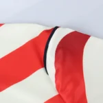 Navy sleeve cuff on wave stripe jersey