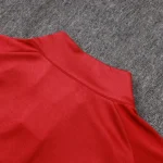 Red long-sleeve soccer training top with athletic panel construction