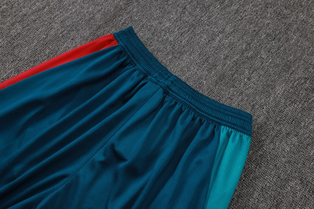 Close-up of elastic waistband and panel construction on soccer training pants