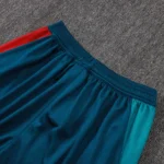 Close-up of elastic waistband and panel construction on soccer training pants